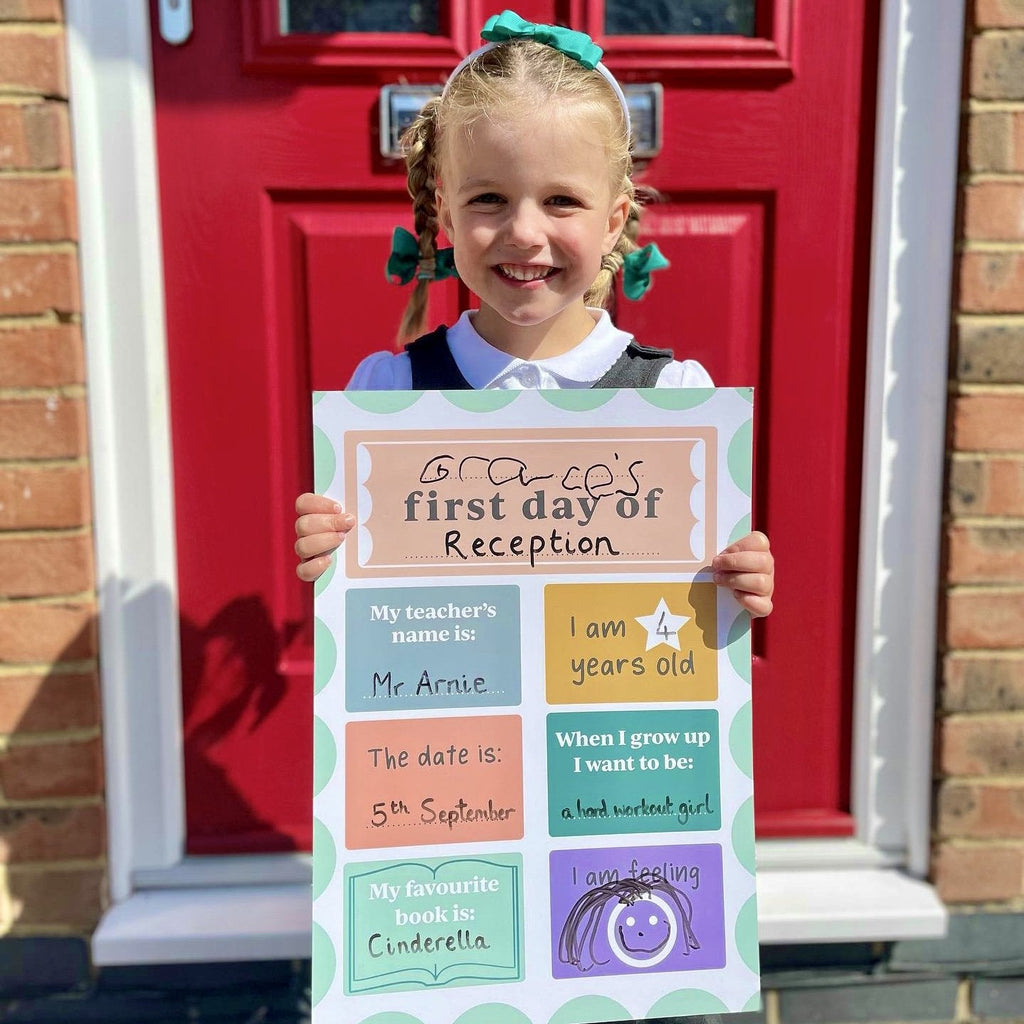 Child holding Play makes Sense First Day of School Board