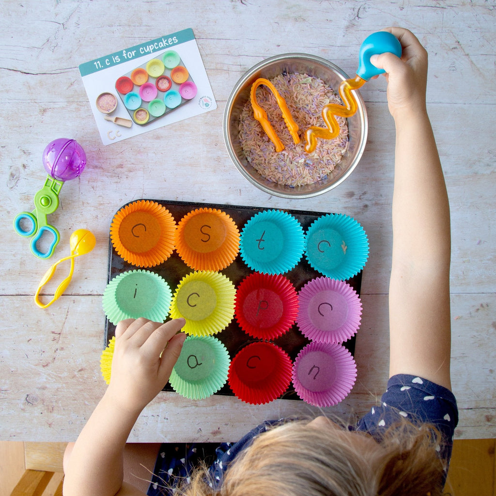 Young child playing a Phase 2 Phonics letter game