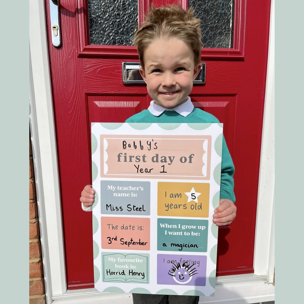 Child holding Starting School Board