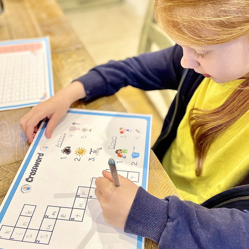 Child completing crossword from the Phonics Activity Pack Phase 2